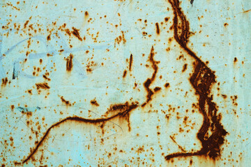 old rusty metal background with drawings and scratched green paint - background