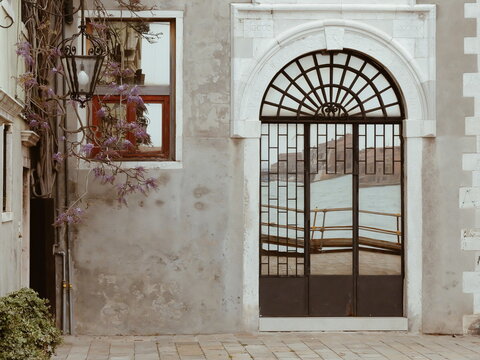 A reflection of a Venetian canal in the mirror door