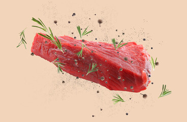 Fresh raw meat and different spices flying on beige background