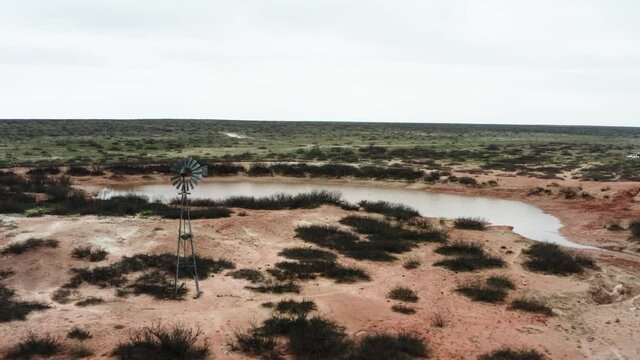 Lonely unusable windmill lost in deserted area in aerial view