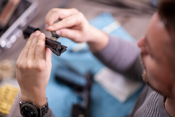 Man cleaning gun