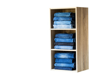Jeans stack on the shelves in the store at supermarket.clipping path.