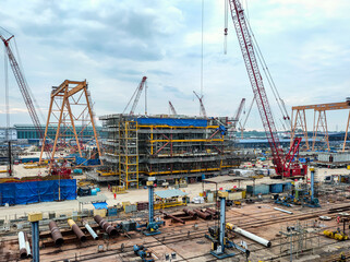 Fototapeta na wymiar Lumut Port, Perak, 6 March 2021: View of the construction site of the oil rig structure which is being actively done by workers from Sapura energy company.