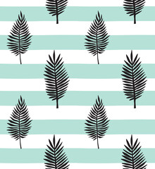 Vector seamless pattern of hand drawn palm leaves silhouette isolated on mint stripped background
