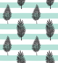 Vector seamless pattern of hand drawn palm leaves silhouette isolated on mint stripped background