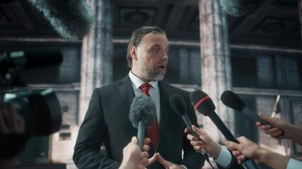 Organization Representative Answering Press Questions and Giving Interview Outside a Parliament, Court or Other Government Building. Press Officer or Businessman Crowded by News Journalists. 