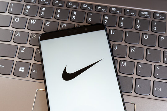 Toronto, On, Canada - March 11, 2021: Nike logo on smartphone screen on keyboard. Nike, Inc. is an American multinational corporation. 