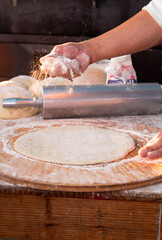 flour the dough to make a pizza base