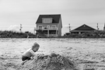 Toddler Making Sandcastle