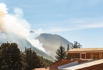 Cloud of smoke caused by a forest fire in the mountains of the Yungas region in Bolivia.