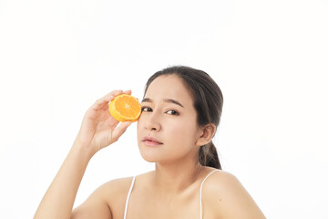 woman with sliced orange on white
