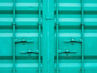 Front doors of the green cargo container. Shipping container.