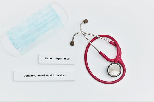 Image displaying the Health care concepts of 'Patient Experience' and 'Collaboration of Health Services' displayed on white background with stethoscope and mask included