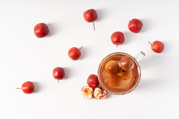 Fresh hawthorn juice on pure white background