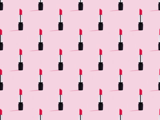Red tinted balm lipstick tube on neutral pink background. Pop art style. Seamless pattern