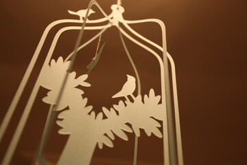 paper silhouette of birds in a tree