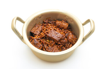 Jjapaguri or Chapaguri, Korean Black Beans Spicy Noodles with Beef on white background