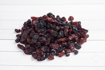 A handful of delicious dried raisins from dark grapes.