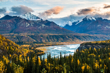 Fototapeta premium dramatic autumn sunrise in the snow capped Chugach mountain range and Matanuska river in Alaska.