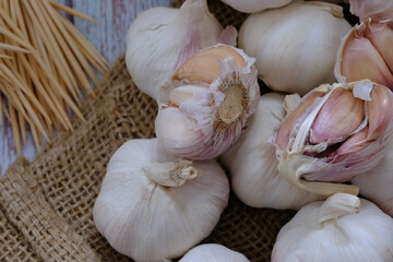 Garlic, spices for cooking are placed in the kitchen.