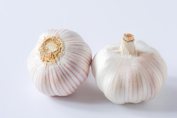 Garlic, spices for cooking are placed in the kitchen.