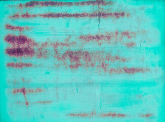 Fototapeta na wymiar Multicolored background: rusty metal surface with blue paint flaking and cracking texture