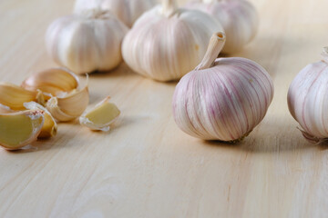 Garlic, spices for cooking are placed in the kitchen.
