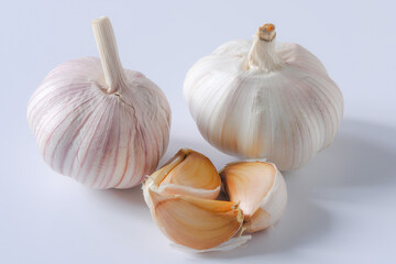 Garlic, spices for cooking are placed in the kitchen.