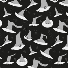 Monochrome pattern in black and white colors with witch's hats with ribbons and buckles in handrawn style.