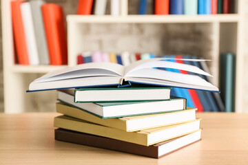 Stack of books on table in room