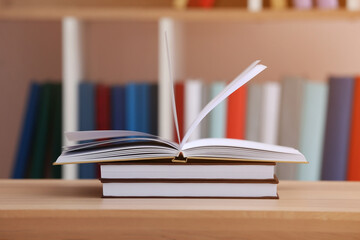 Stack of books on table in room