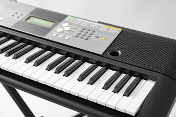 Obraz na płótnie Canvas Stylish synthesizer on light background, closeup