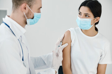 doctor syringe Temryuk protective gloves close-up vaccination 