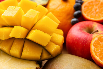 Different tropical fruits as background