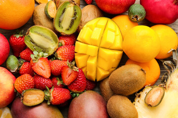 Different tropical fruits as background