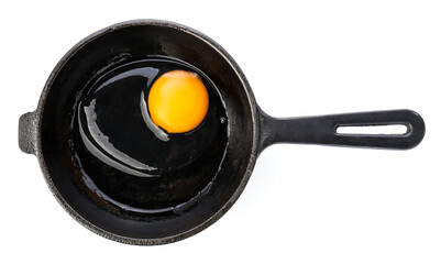 Frying pan with raw egg on white background