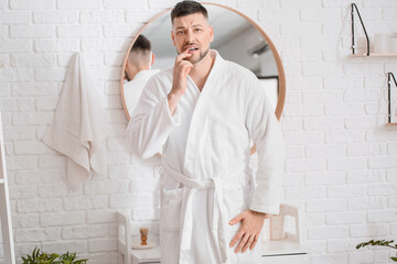Man suffering from tooth ache in morning