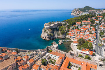 Aerial drone shot West Pier in Dubrovnik old town Fort Lovrijenac in Croatia summer