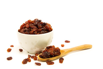 Raisins in cup isolated against white background