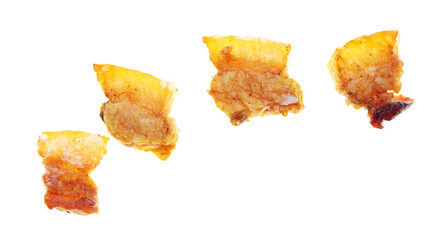 Fried lard cracklings on a white plate.