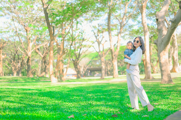 Fototapeta premium Mother And Baby outdoors. Nature.Portrait of happy loving mother