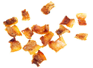 Fried lard cracklings on a white plate.
