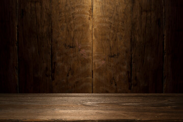 Selected focus empty brown wooden table and wall texture or old black brick wall blur background image. for your photomontage or product display