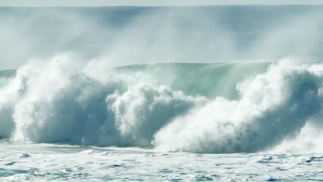 Aerial view of huge waves in Sagres, Portugal, like roaring beasts 