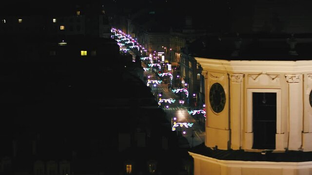 Looking down street in Vilnius Old Town ornamented in beautiful light on Independence Day. Aerial