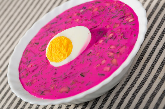 Delicious cold yogurt beetroot soup with cucumber and eggs