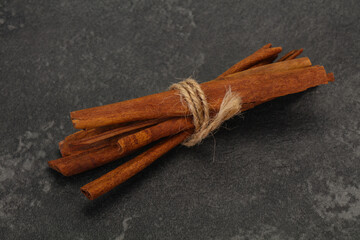 Aroma cinnamon sticks over dark