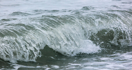 Wave in the sea with splashing water.