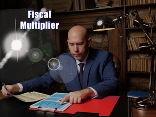 Conceptual photo about Fiscal Multiplier Businessman, executive manager hand filling paper business...