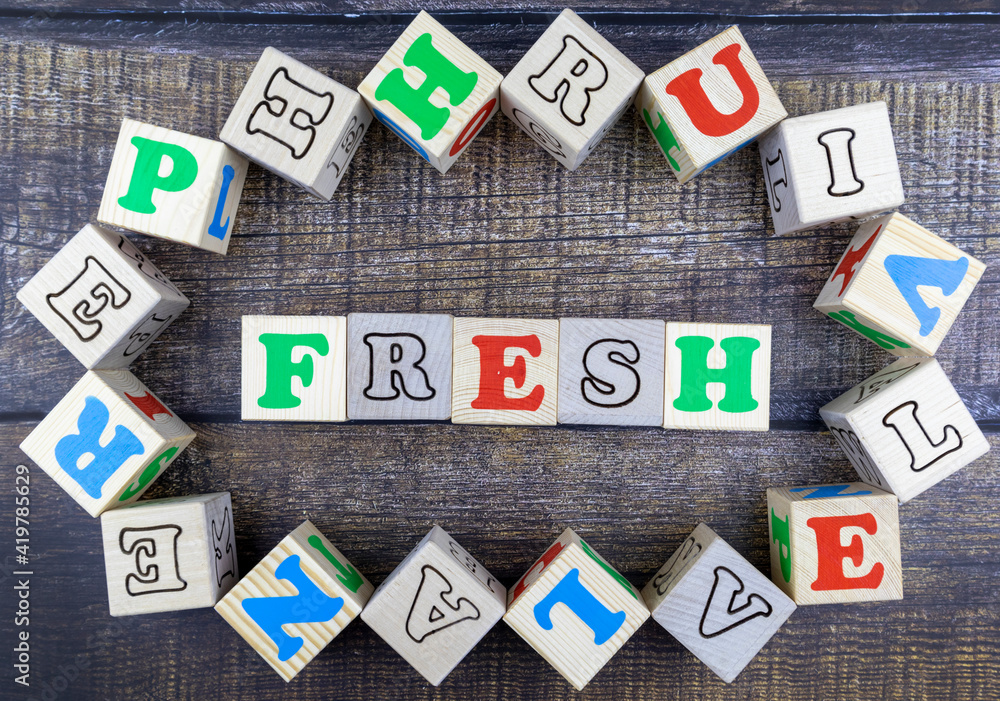 Fototapete word - fresh - in colorful alphabet letters on wooden cubes surrounded by a frame of additional rand